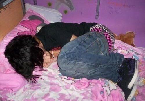 emo kid lying on bed